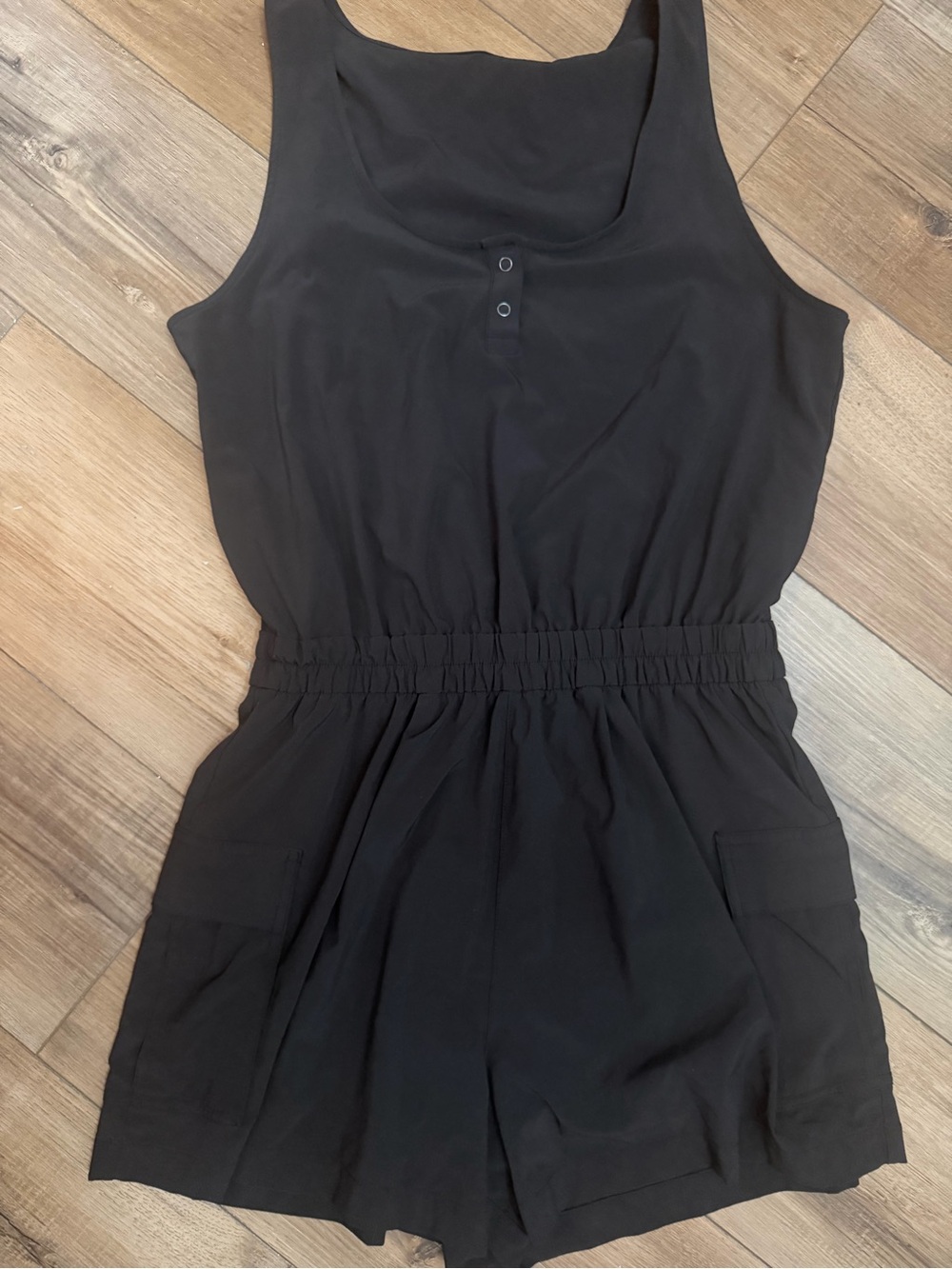 Vuori Black Sleeveless Romper with Elastic Waist and Pockets